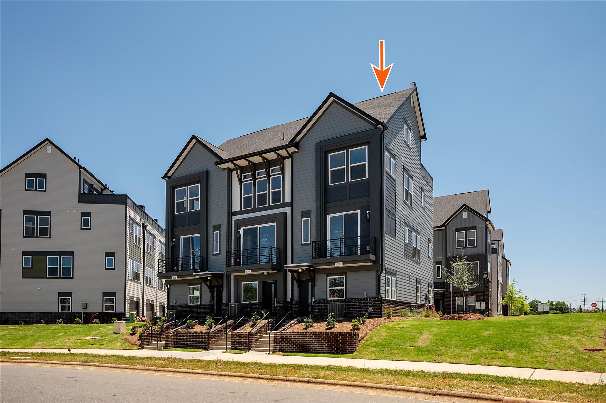 car_eqx1873_060826_vt-01-front-building-ext-w-arrow